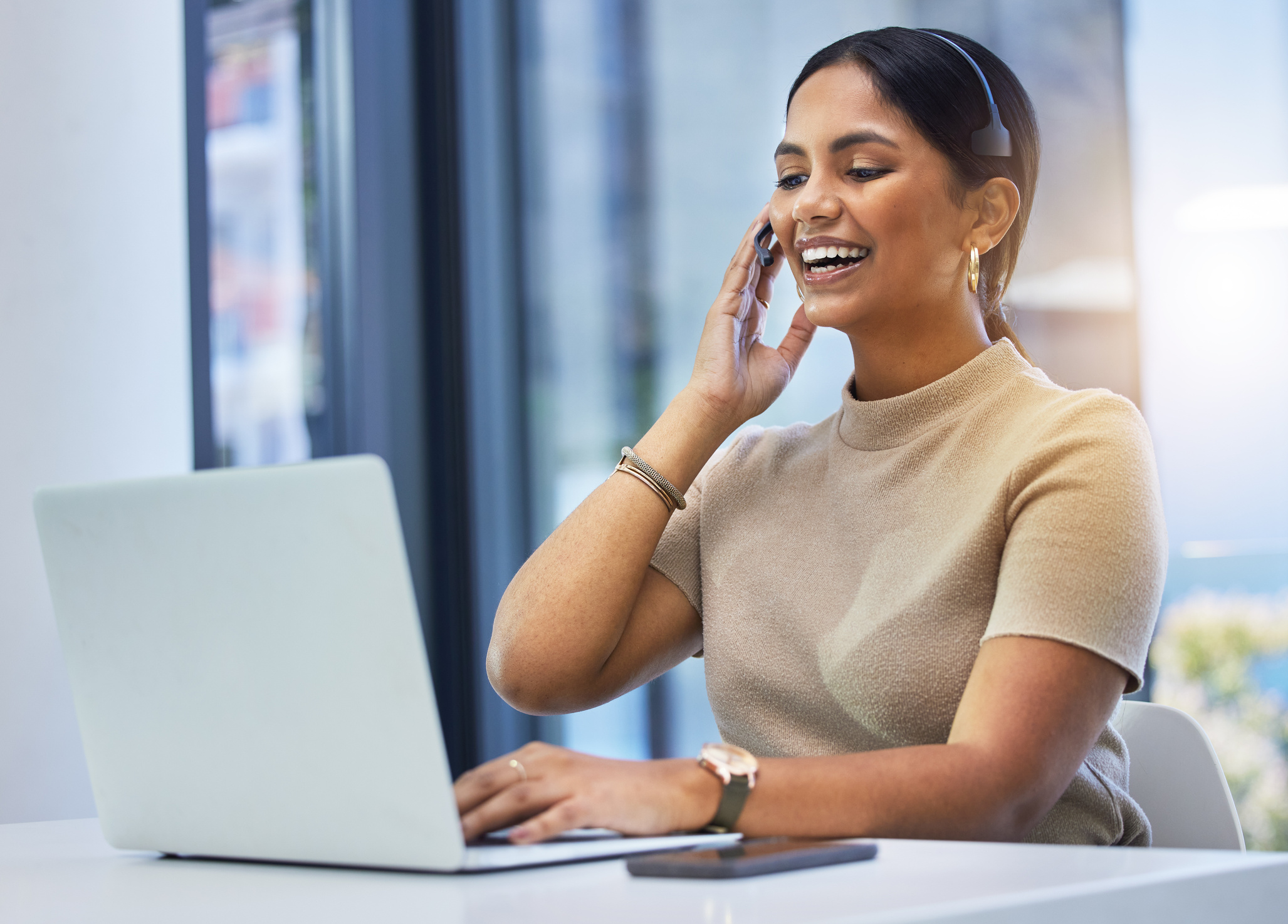 Agent, Happy Woman and Video Call at Laptop in Office for Customer Service, Sales Consulting and Questions. Telemarketing, Female Consultant and Communication at Computer for Virtual Telecom Advisory